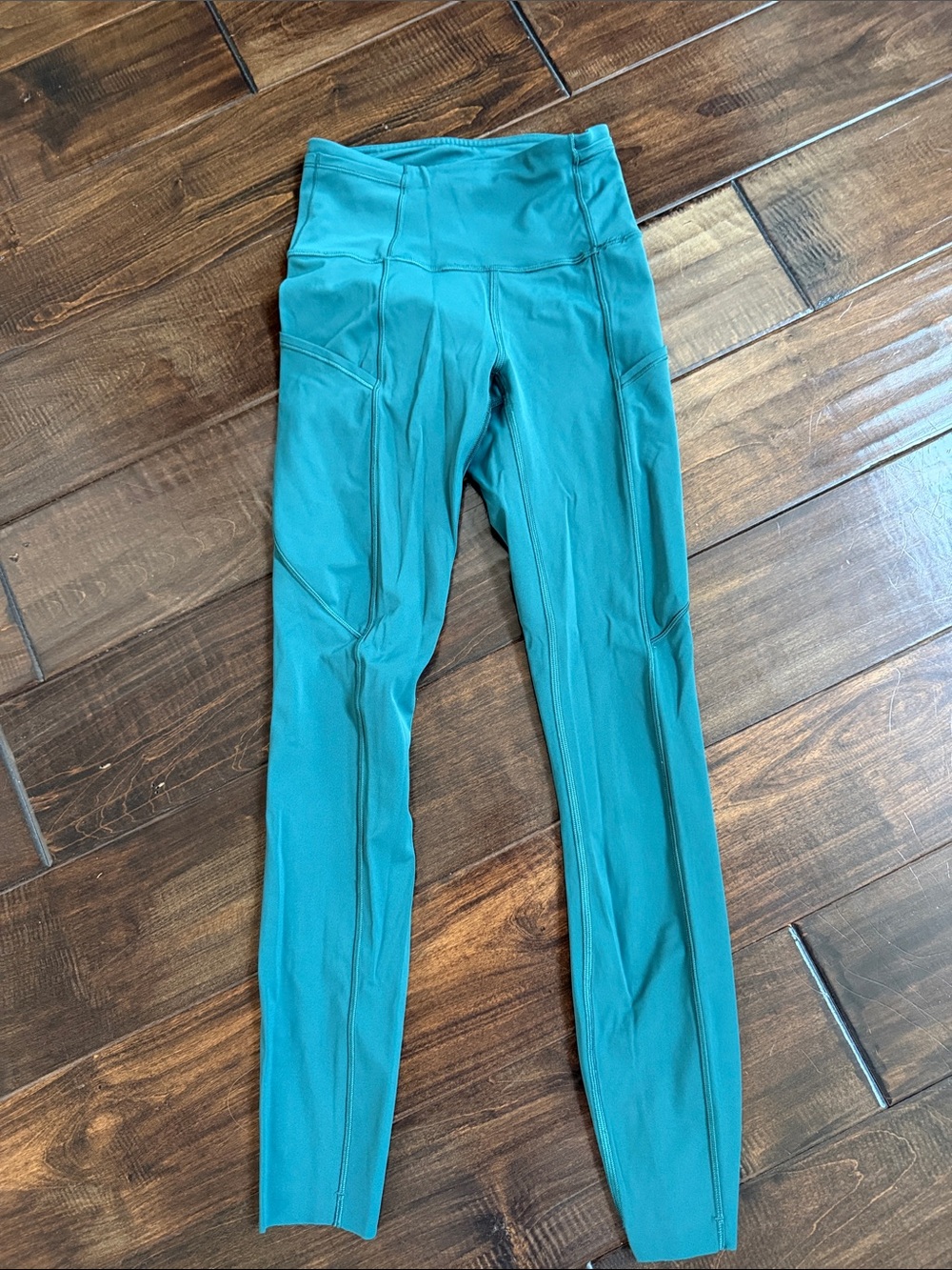 Women’s Lululemon pants in hunter green.